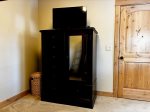 Large dresser and TV in the den bedroom